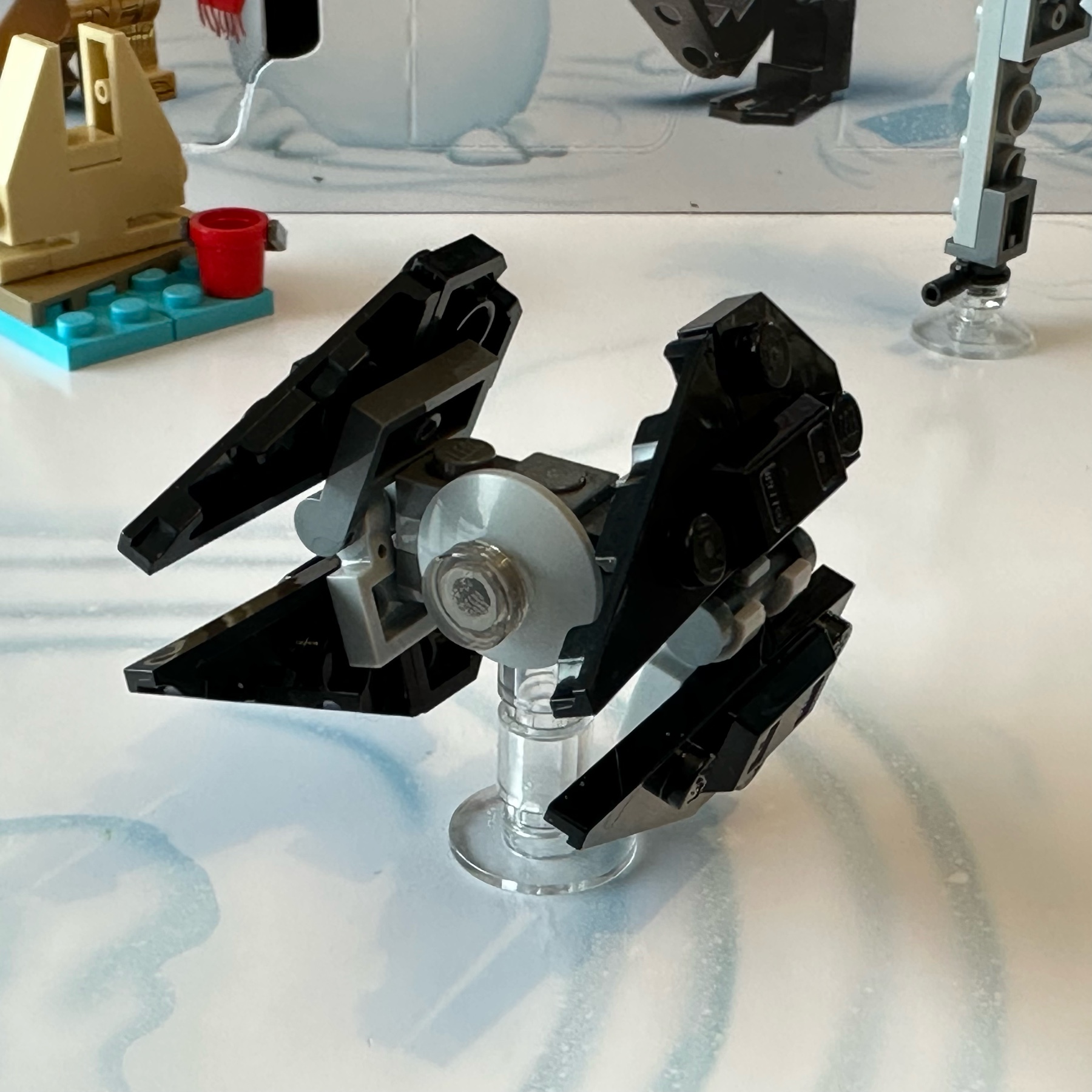 LEGO micro-scale model of a TIE Interceptor spaceship from Star Wars.