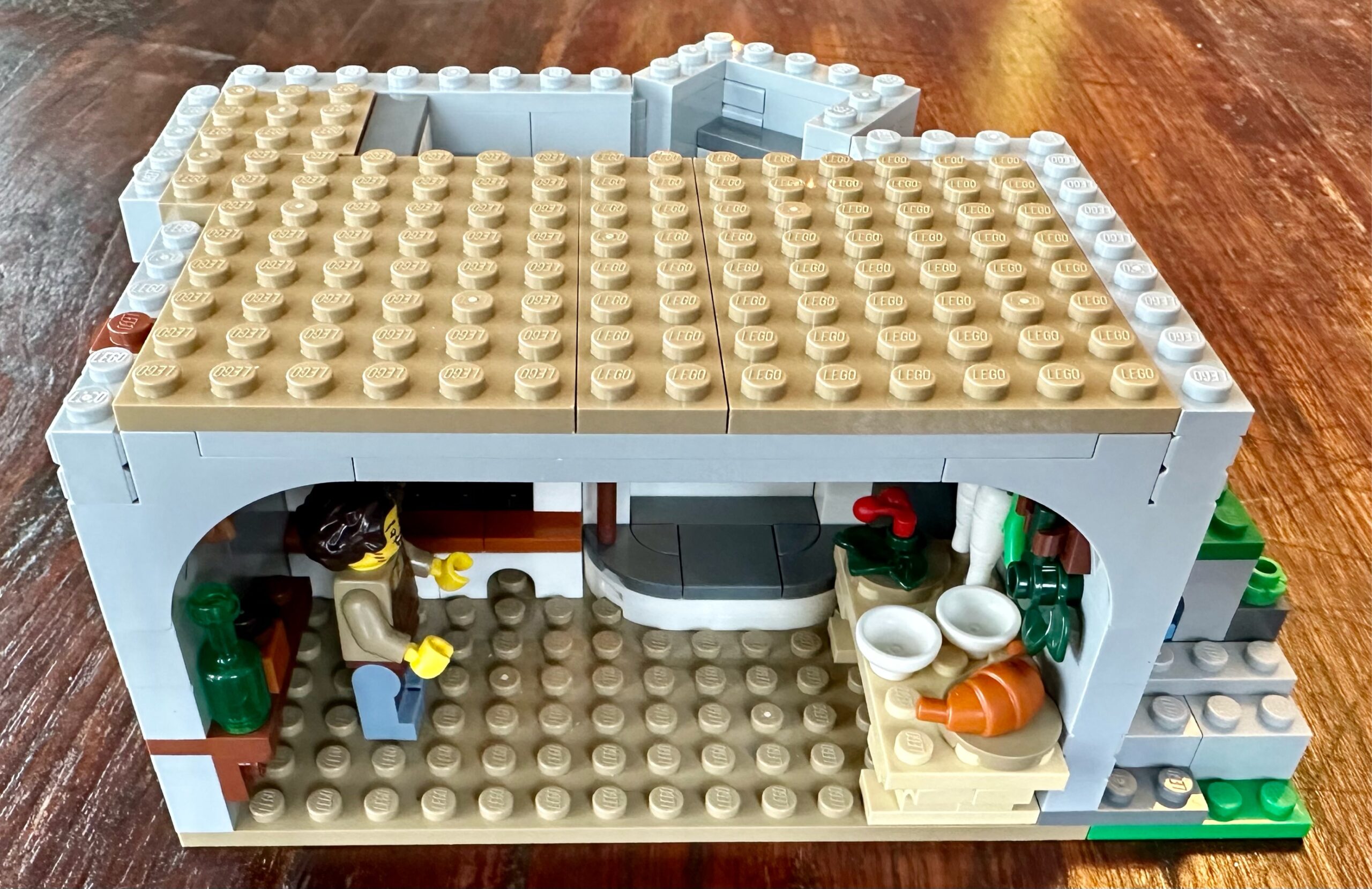 LEGO kitchen with a cook, fireplace, various utensils and food stuffs