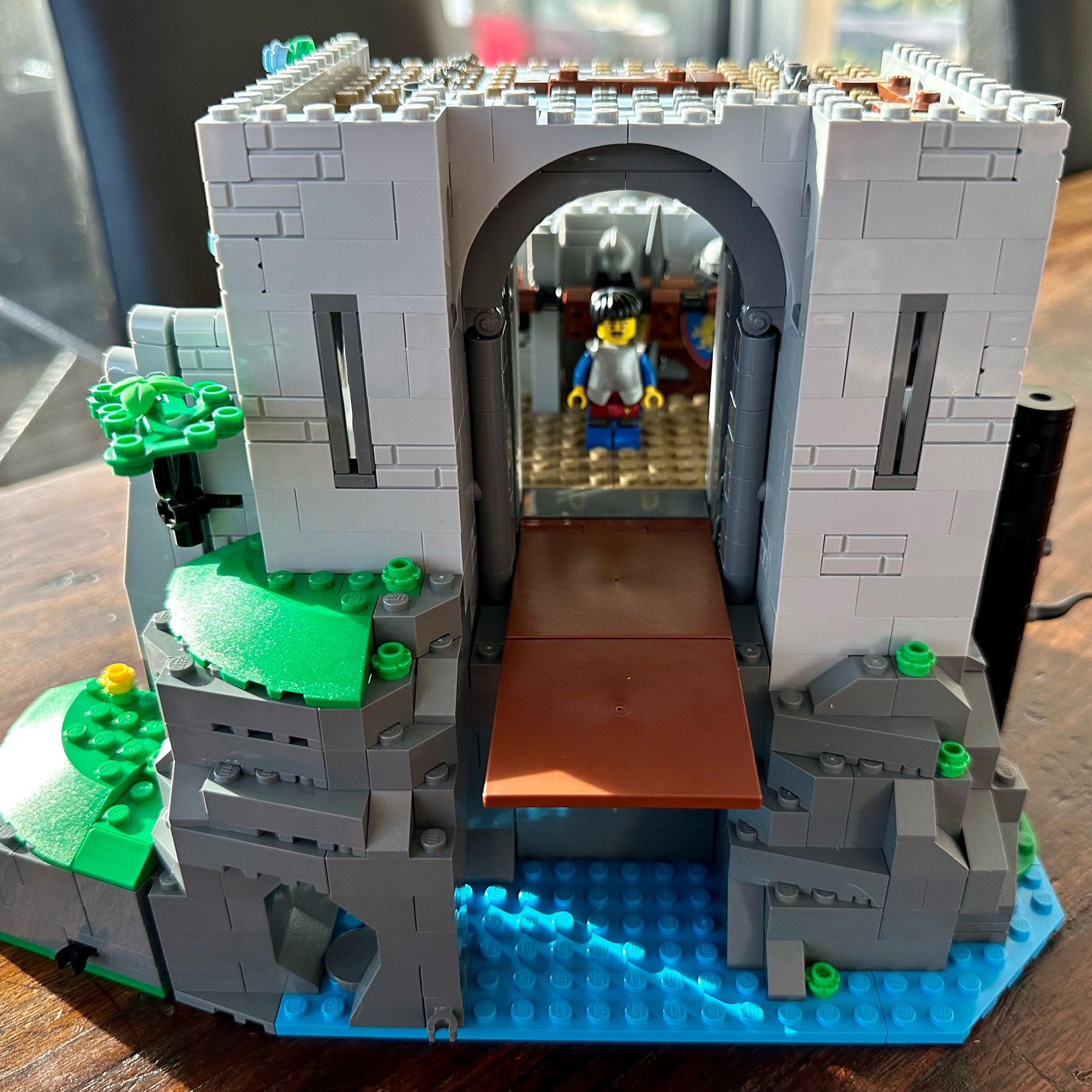 LEGO Castle exterior front view with drawbridge lowered and a guard standing in the doorway.