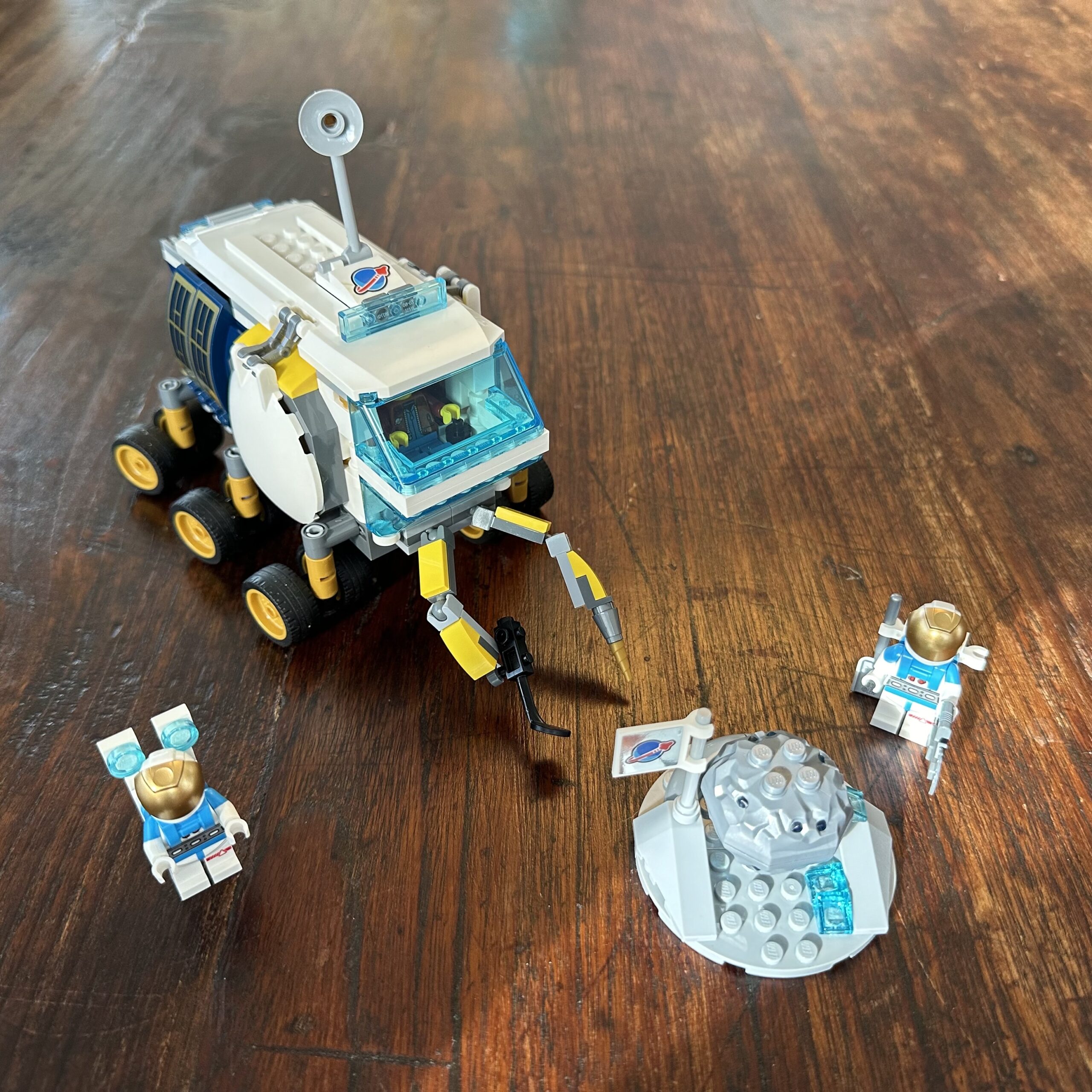 LEGO rover with two astronauts and a geode