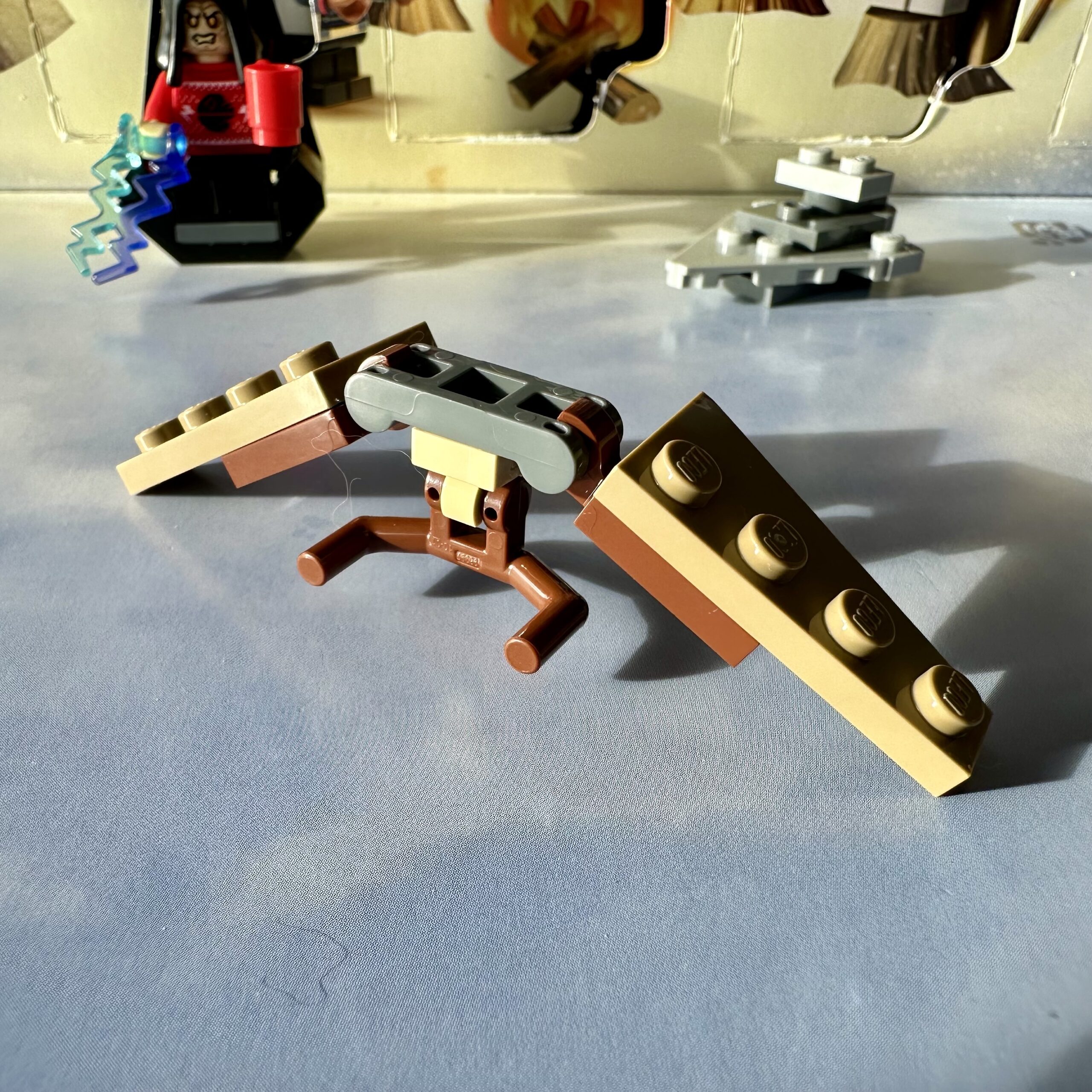 LEGO micro build of an Ewok hang glider made mostly out of brown and tan parts. The results are not good.