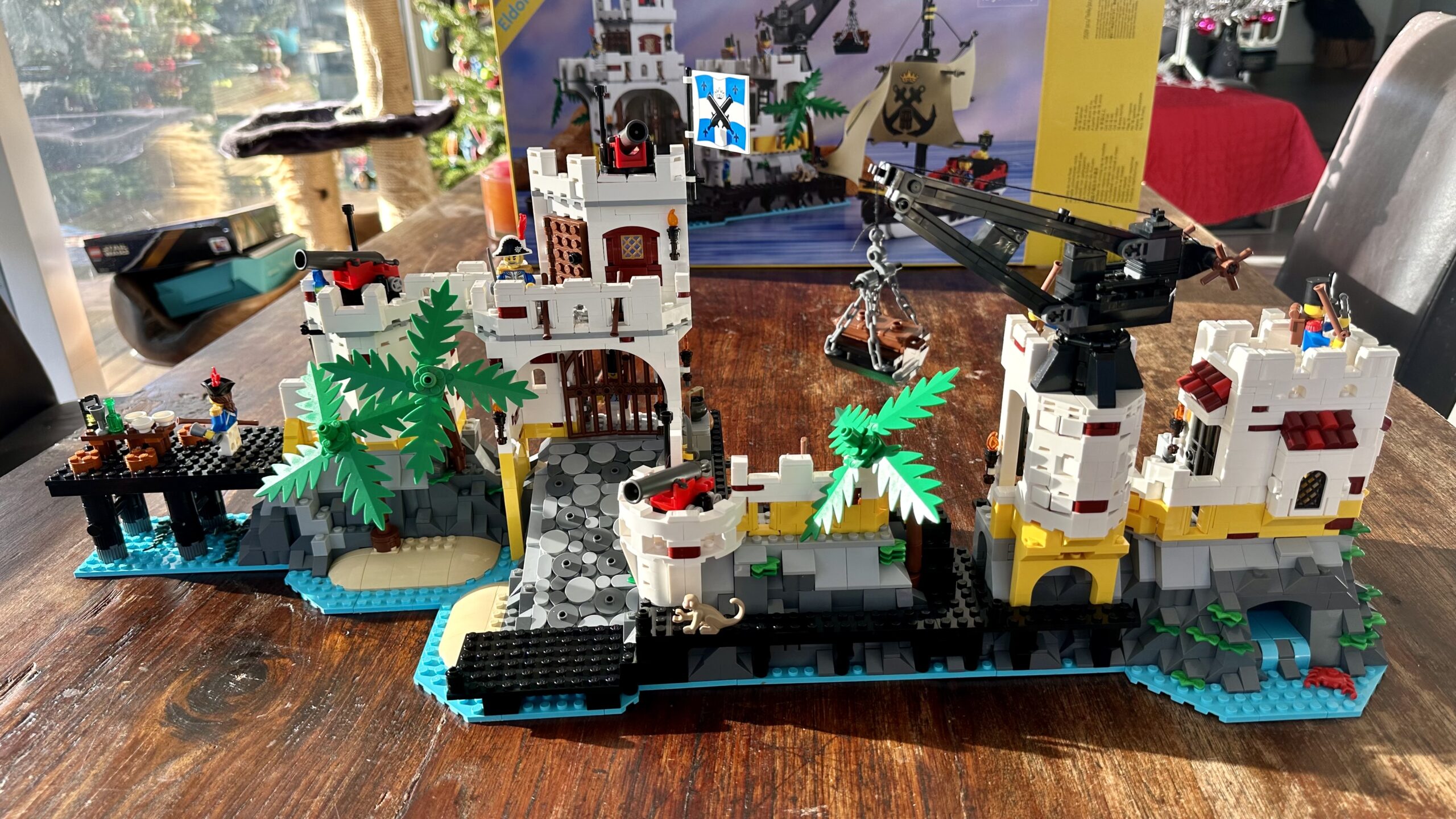 The completed LEGO set 10320 Eldorado Fortress with the sections arranged end-to-end to form a wide seaside wall.