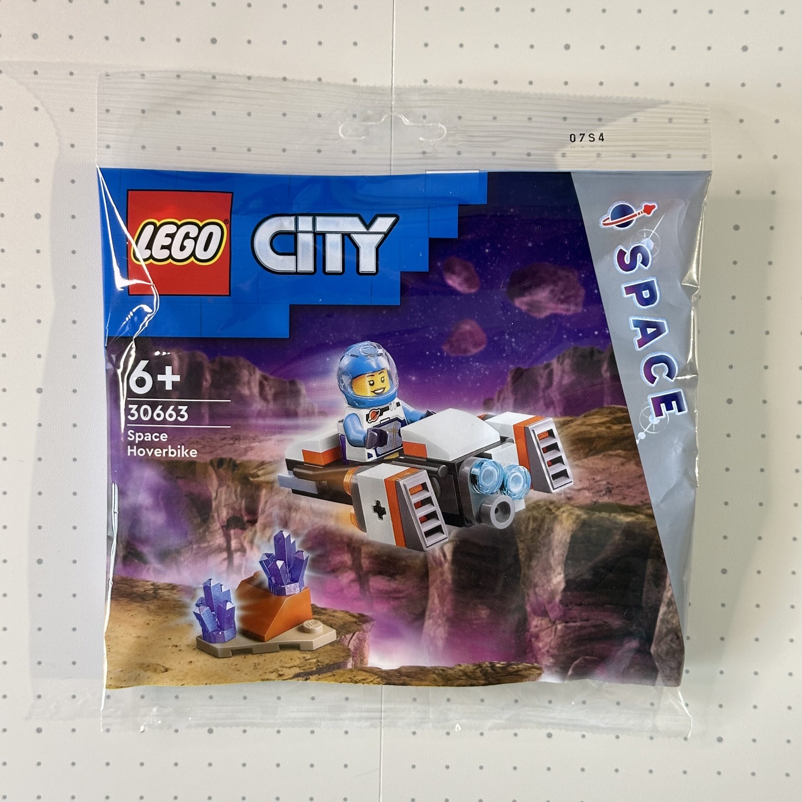Bag for LEGO City Space set 30663 Space Hoverbike. Shows an astronaut flying a white, orange, and gray hover bike over alien terrain in space.